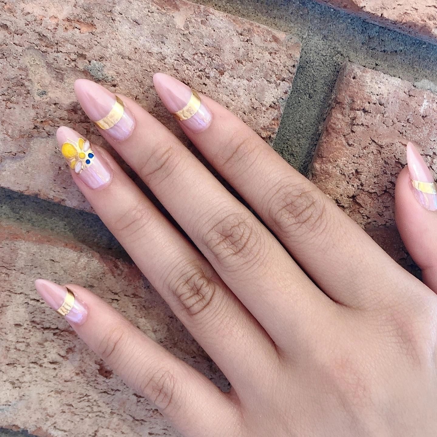 Pink gold daisy nails